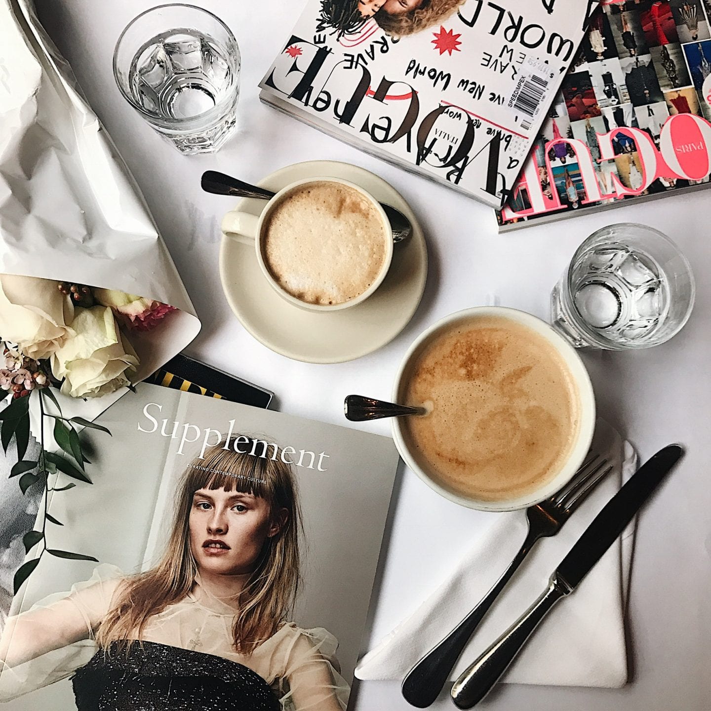 ditching starbucks habit | WHY I'M DITCHING MY STARBUCKS ADDICTION AND HOW YOU CAN TOO by popular San Francisco life and style blog, Just Add Glam: image of a table with magazines, flatware, and coffee cups on it. 